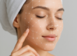 Facial mapping lines on a client's face during AI skin analysis in Pompano Beach